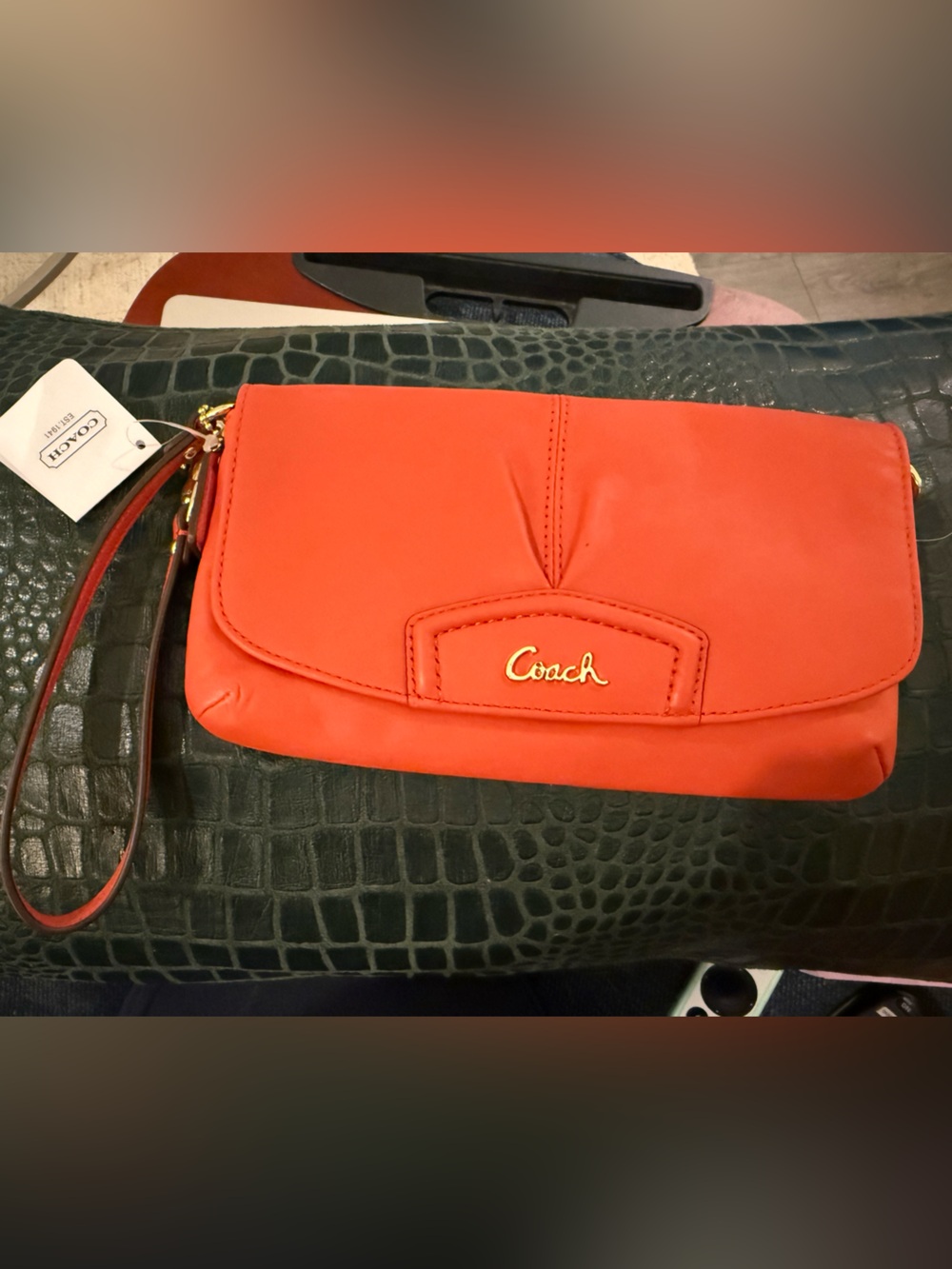 Coach Coral-Orange Leather Wristlet Clutch with Gold Script Logo